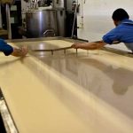 once-approved-by-the-master-cheese-maker-cheese-makers-begin-cutting-the-vat-into-curds-shown-here-is-the-vertical-or-lengthwise-cutting-of-the-vat-cutting-too-soon-will-produce-a-cheese-that-is-too-soft-cutting-too-late-will-produce-hard-and-dry-curds